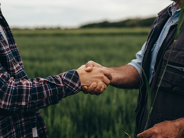 Two farmers shaking hands