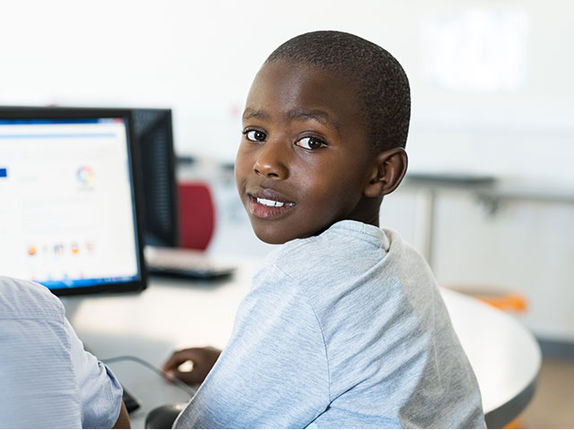 Young boy using computer